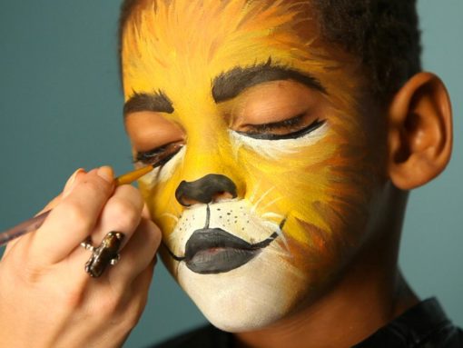 facepainting young mixed race boy